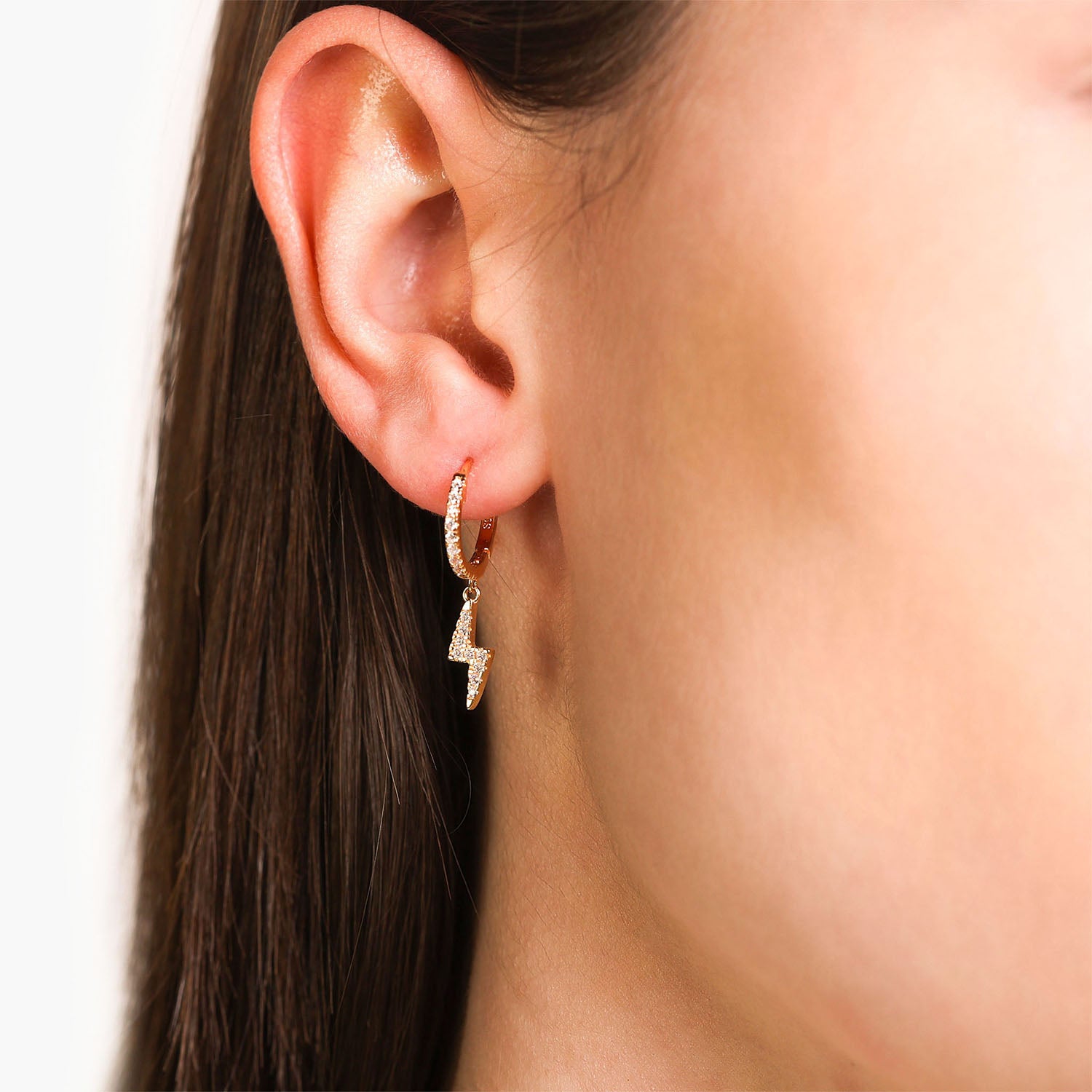 Female Model Wearing Gold Lightning Bolt Huggie Hoop Drop Earrings Ava - Playa Luna Jewelry