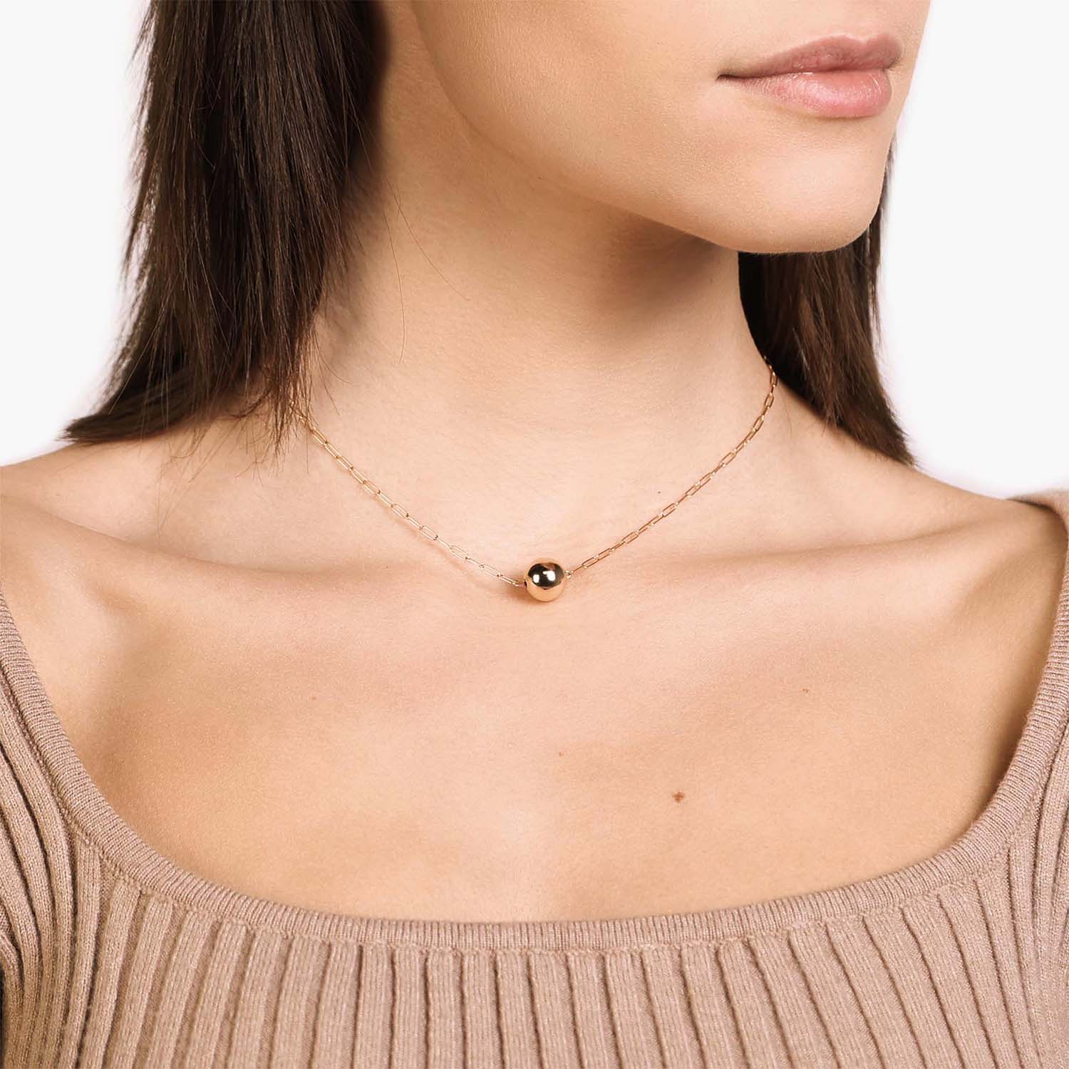 Female Model Wearing Gold Pendant Ball Necklace Aria - Playa Luna Jewelry