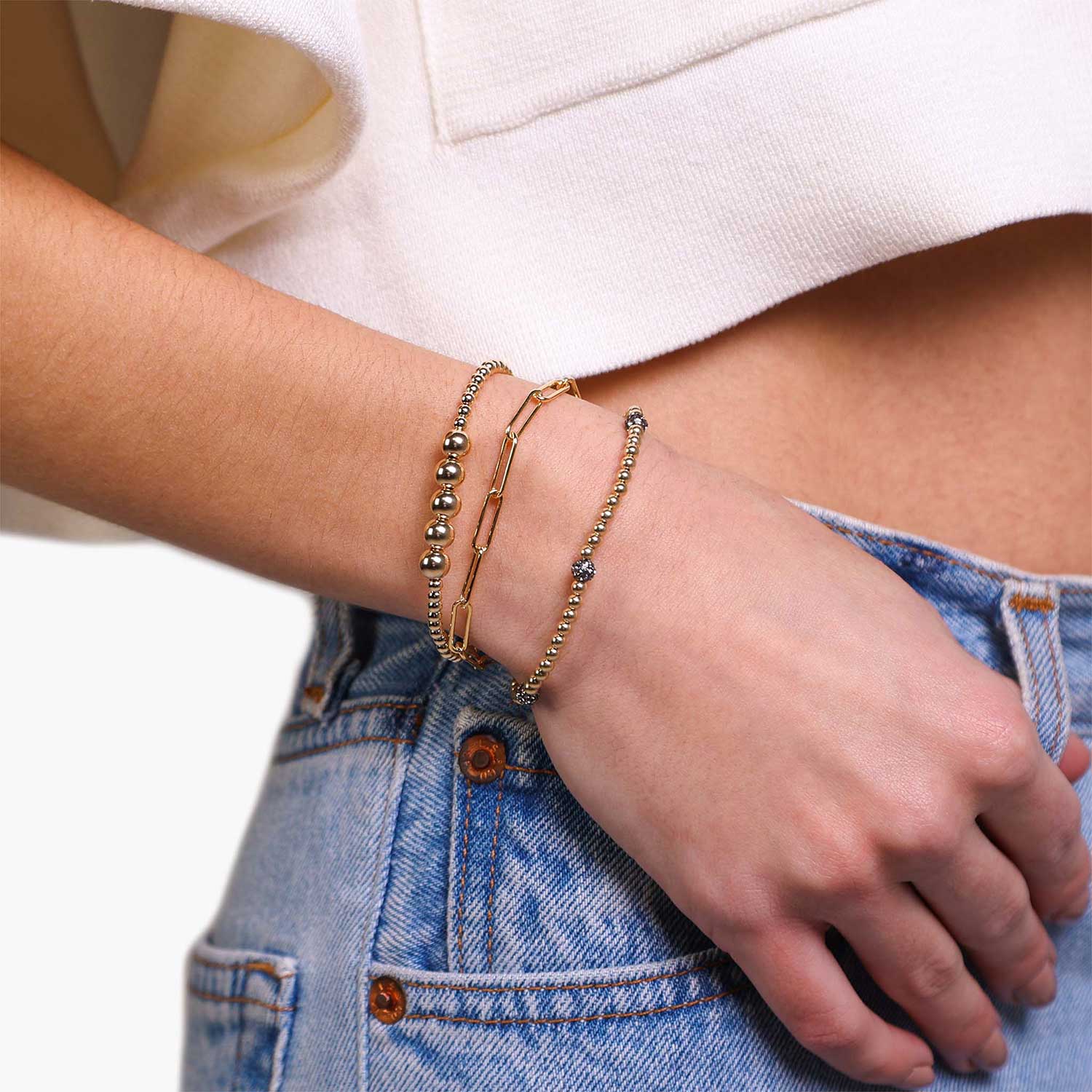Female Model Wearing Layered Gold Bead Bracelet with Gray Gems Demi - Playa Luna Jewelry