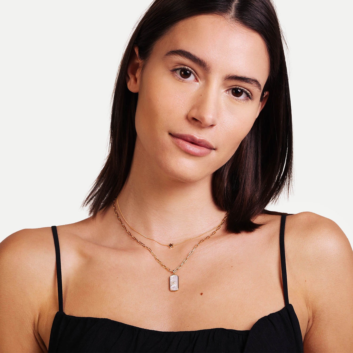 Female Model Wearing Layered Gold Evil Eye Pearl Tag Necklace Olivia - Playa Luna Jewelry