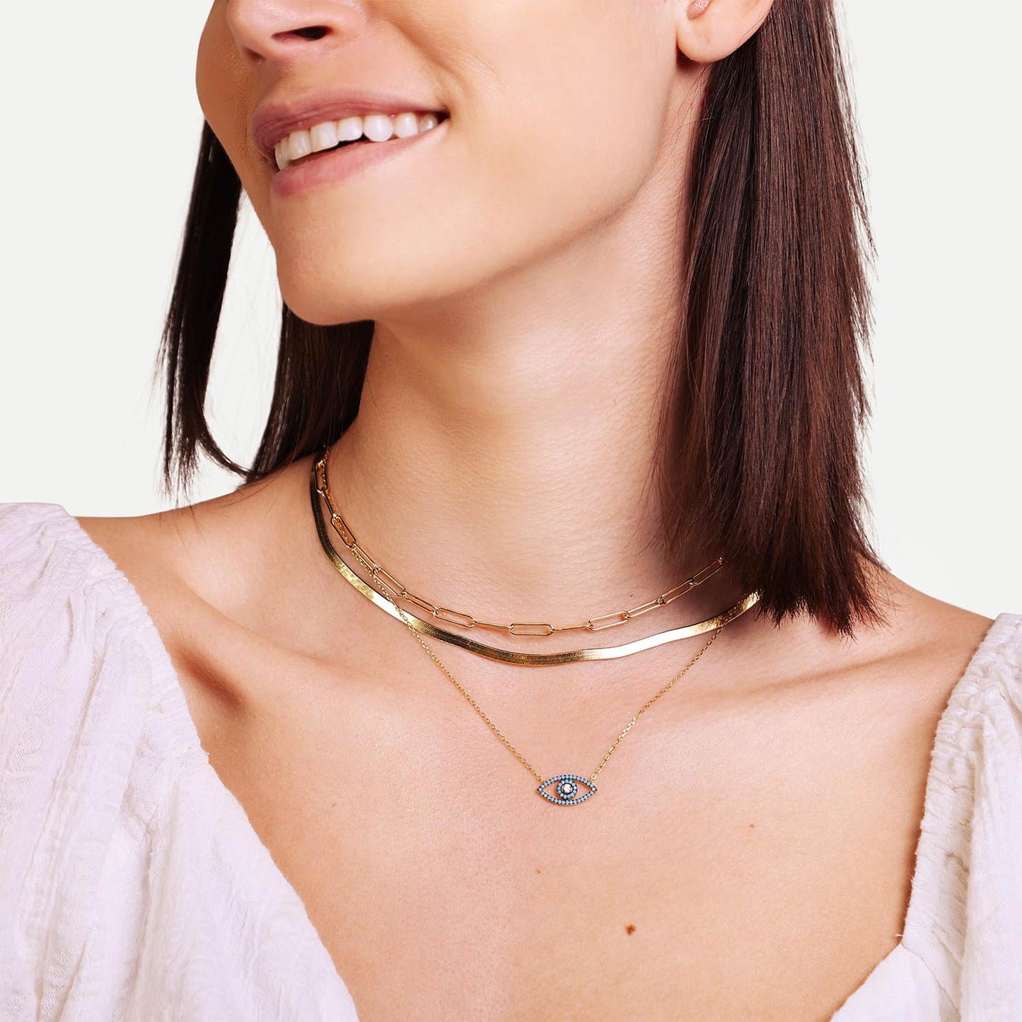 Female Model Wearing Layered Blue and Gold Evil Eye Charm Necklace Cleo - Playa Luna Jewelry