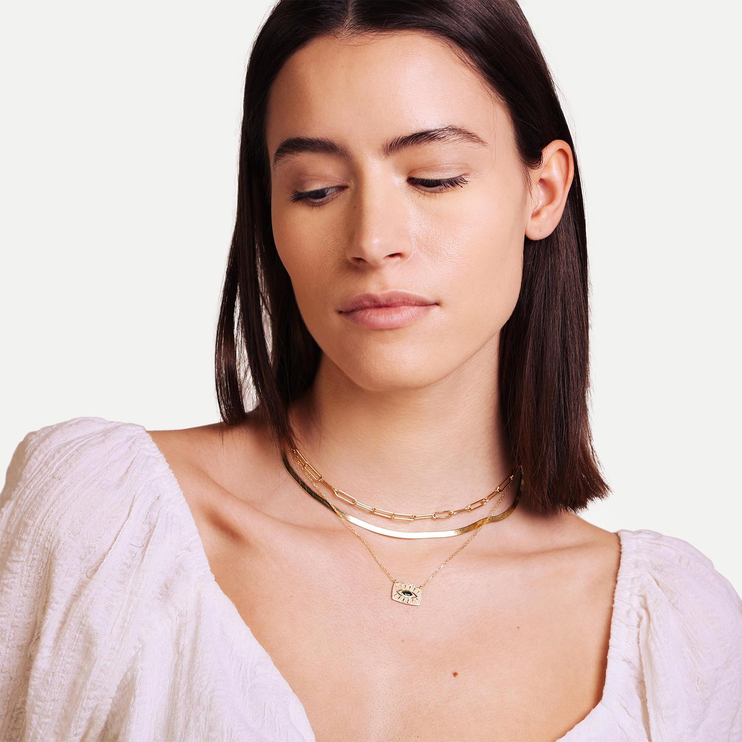 Female Model Wearing Layered Gold Evil Eye Gem Necklace Penelope - Playa Luna Jewelry