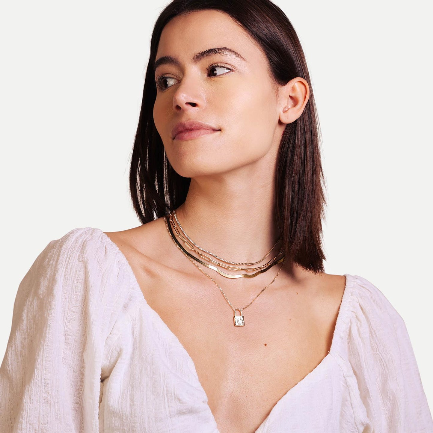 Female Model Wearing Layered Gold Lock Necklace Aurora - Playa Luna Jewelry
