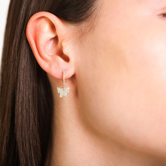 Female Model Wearing Gold Butterfly Huggie Hoop Earrings Alexa - Playa Luna Jewelry