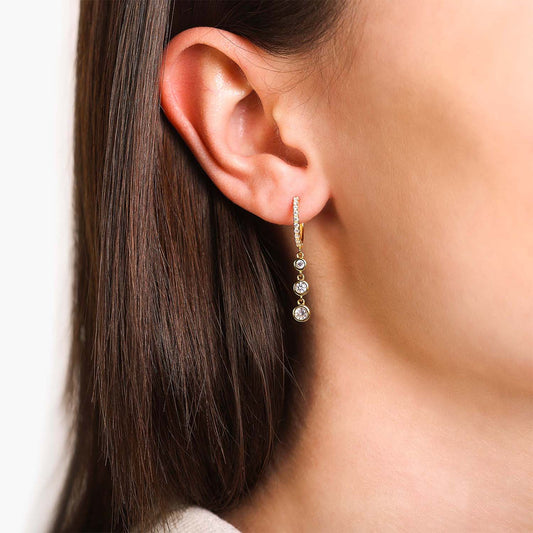 Female Model Wearing Gold Mismatched Huggie Hoop Drop Earrings Cara - Playa Luna Jewelry