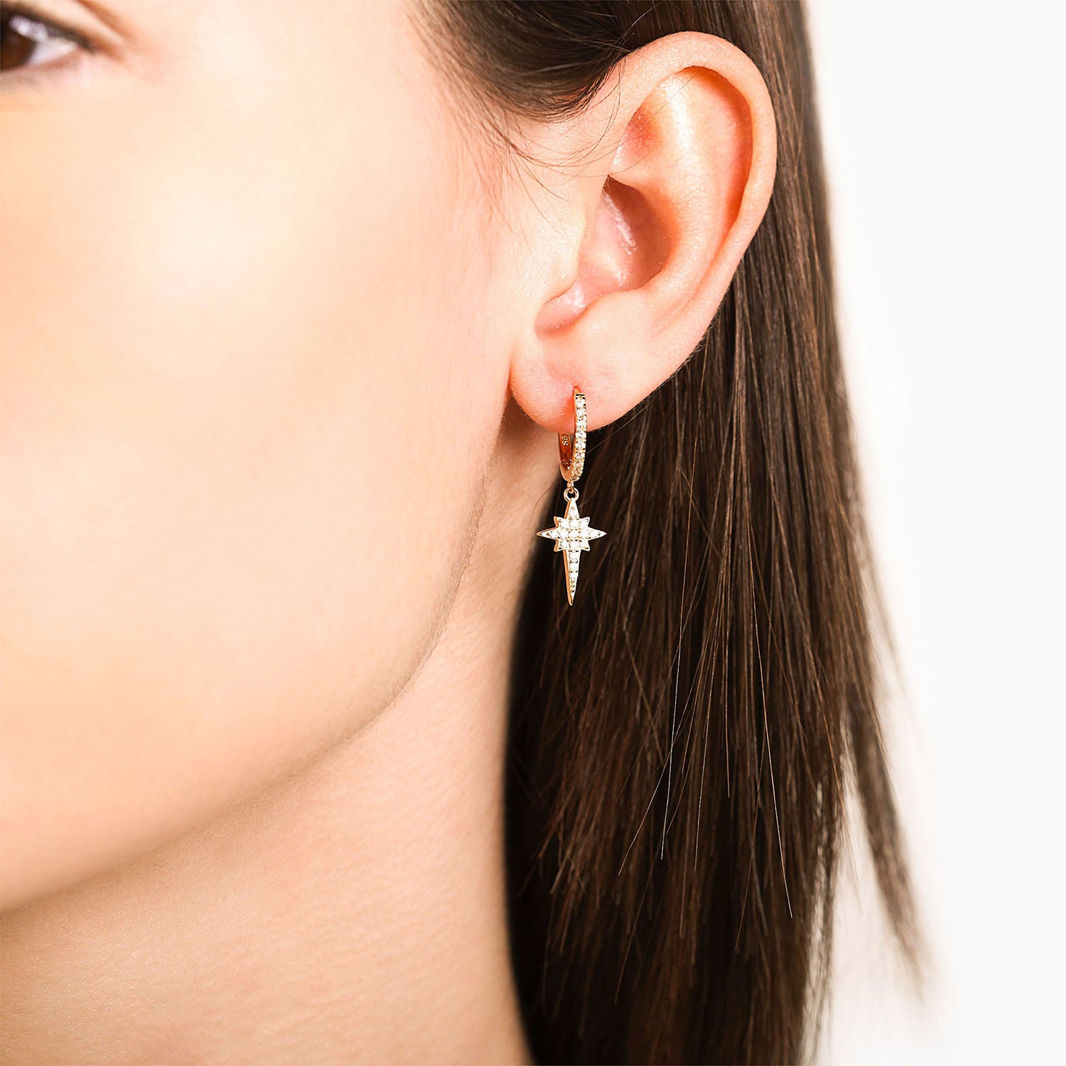 Model Wearing Gold Star Burst Huggie Hoop Drop Earrings Celine - Playa Luna Jewelry 