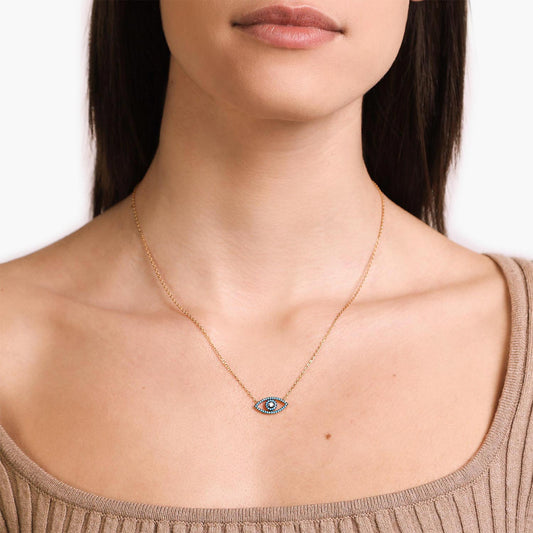 Female Model Wearing Blue and Gold Evil Eye Charm Necklace Cleo - Playa Luna Jewelry