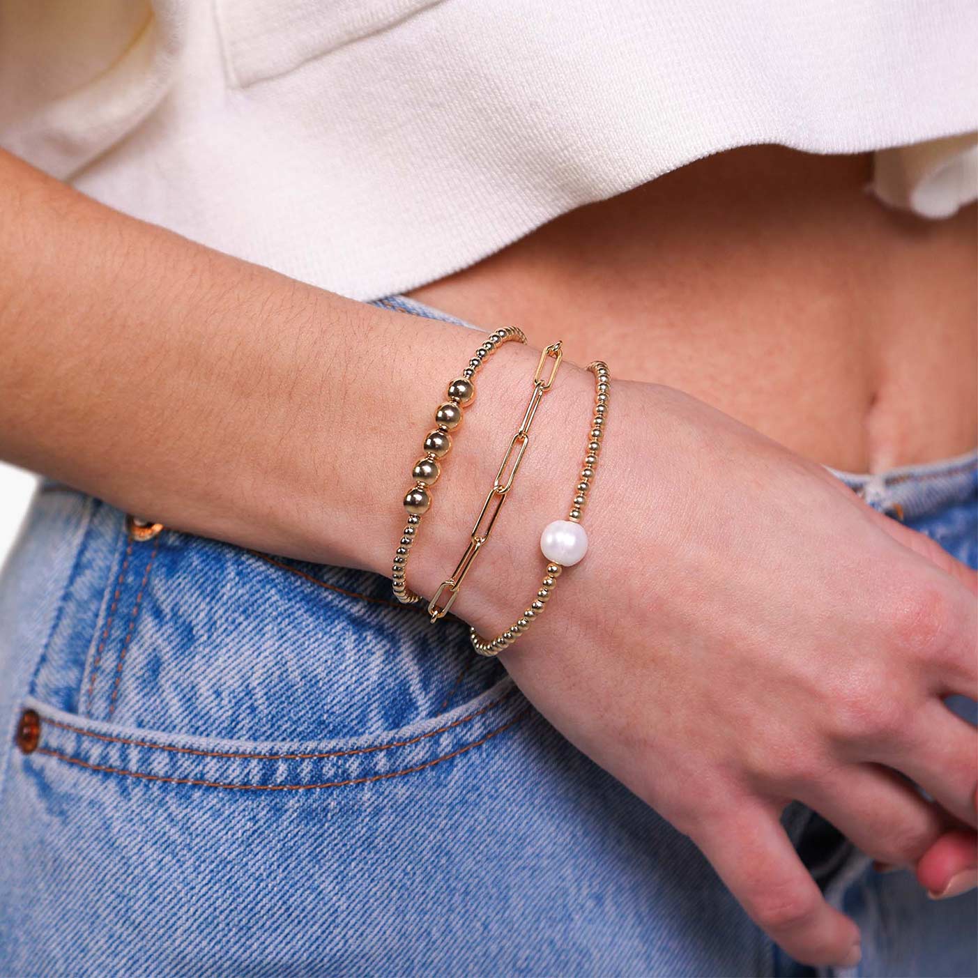 Female Model Wearing Layered Gold Filled Pearl Bead Bracelet Chelsea - Playa Luna Jewelry