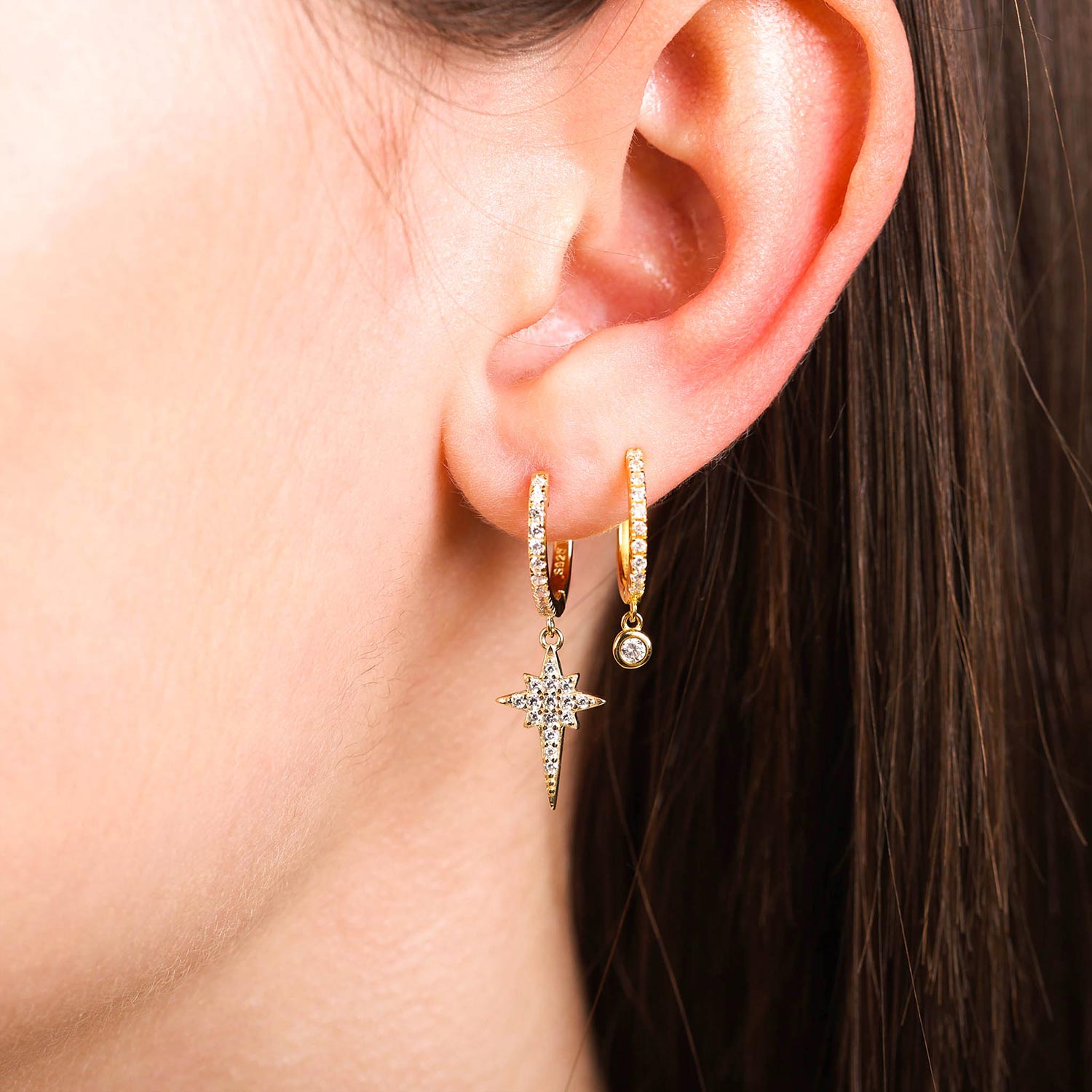 Model Wearing Layered Gold Star Burst Huggie Hoop Drop Earrings Celine - Playa Luna Jewelry 