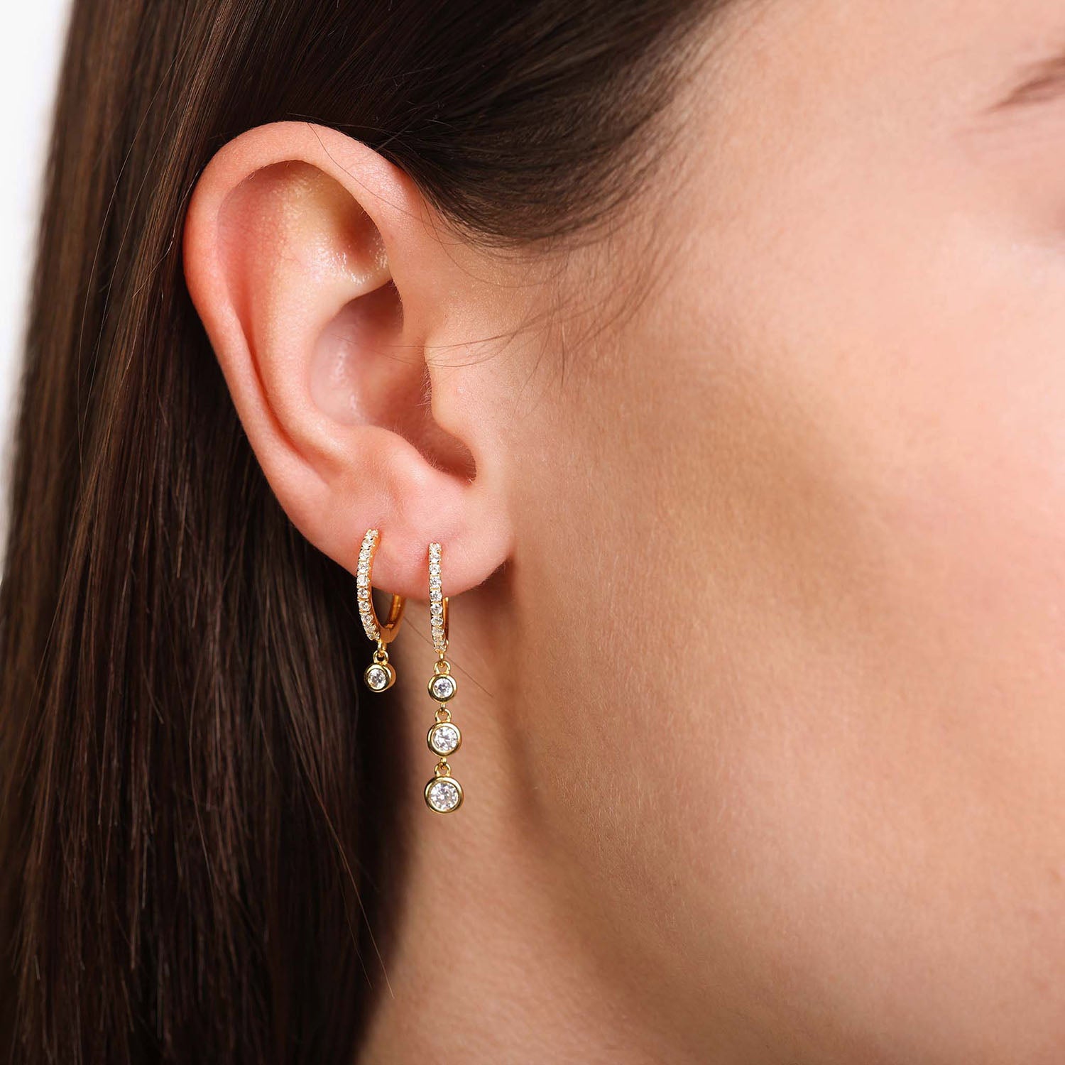 Female Model Wearing Layered Gold Mismatched Huggie Hoop Drop Earrings Cara - Playa Luna Jewelry