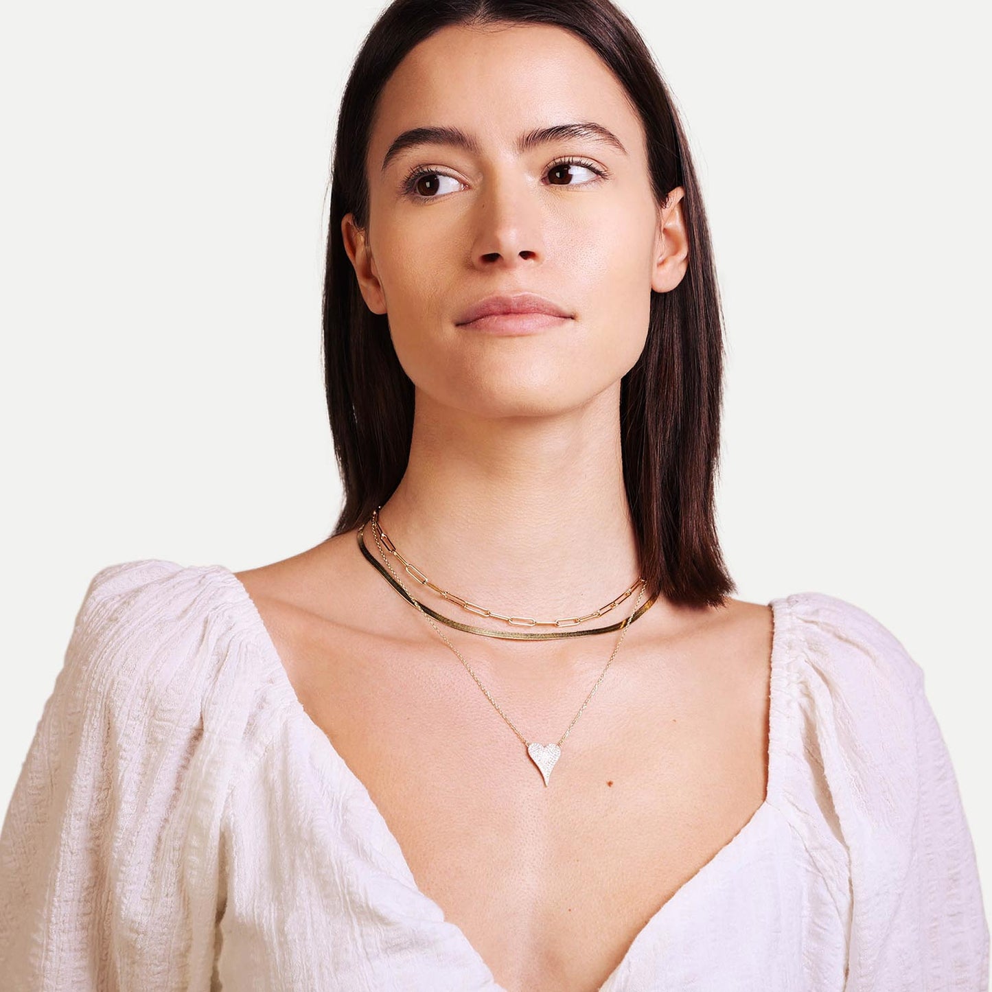 Female Model Wearing Layered Gold Heart Necklace Phoebe - Playa Luna Jewelry