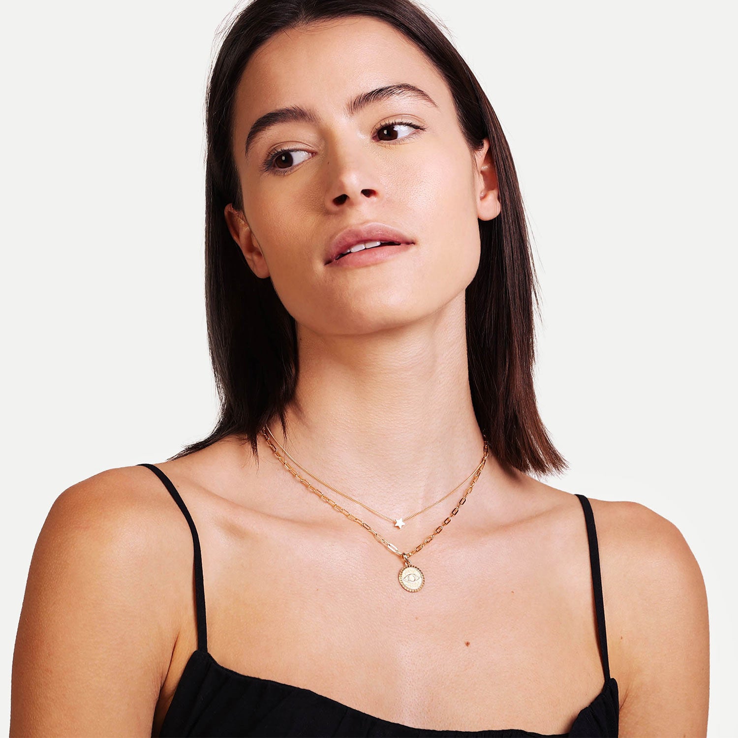 Female Model Wearing Layered Gold Star Necklace Celeste - Playa Luna Jewelry